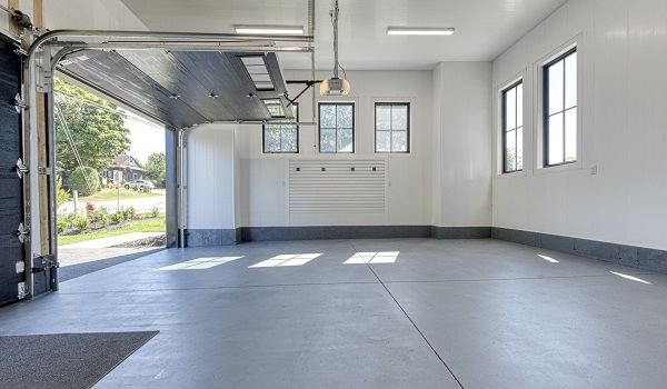 Different paint finishes applied to garage walls and ceiling showing semi-gloss, satin, and epoxy options.