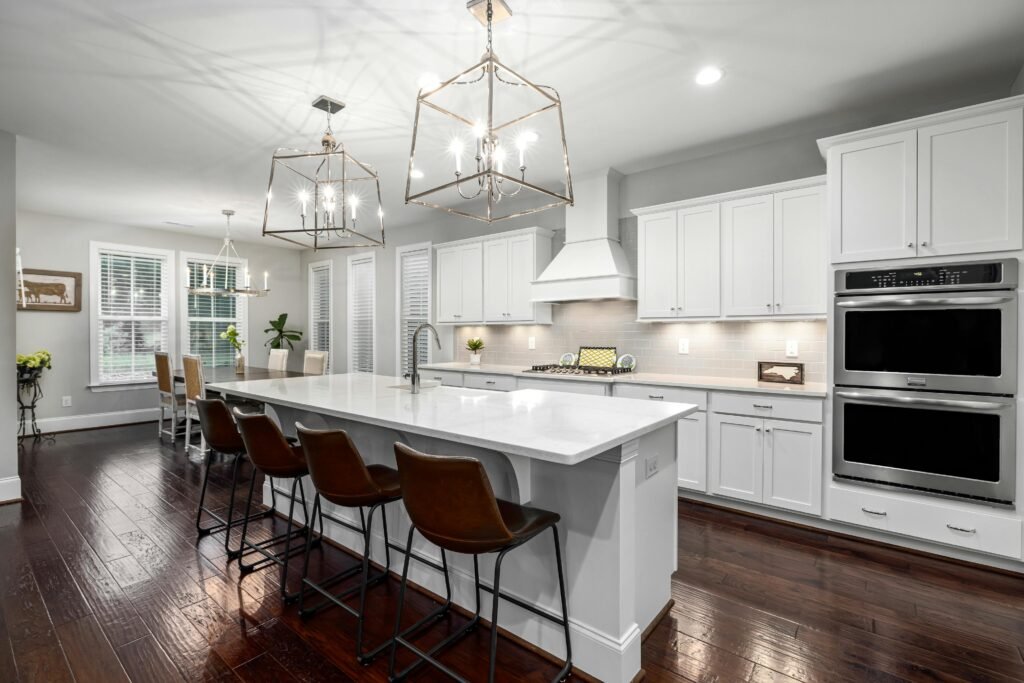 Modern kitchen cabinets with crown molding, soft-close drawers, and under-cabinet lighting.
