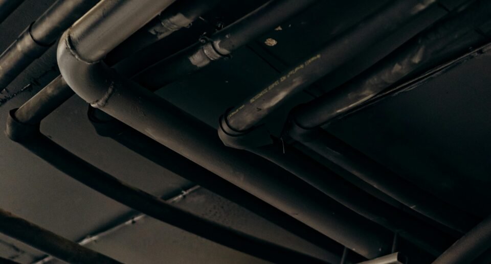 Emergency plumbing services fixing a burst pipe.